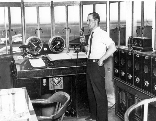 An air traffic controller at work inside tower