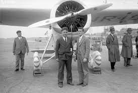 two man standing in front of airplane