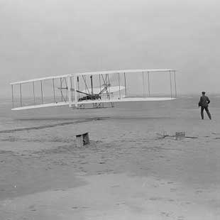 black and white photo of first flight airplane